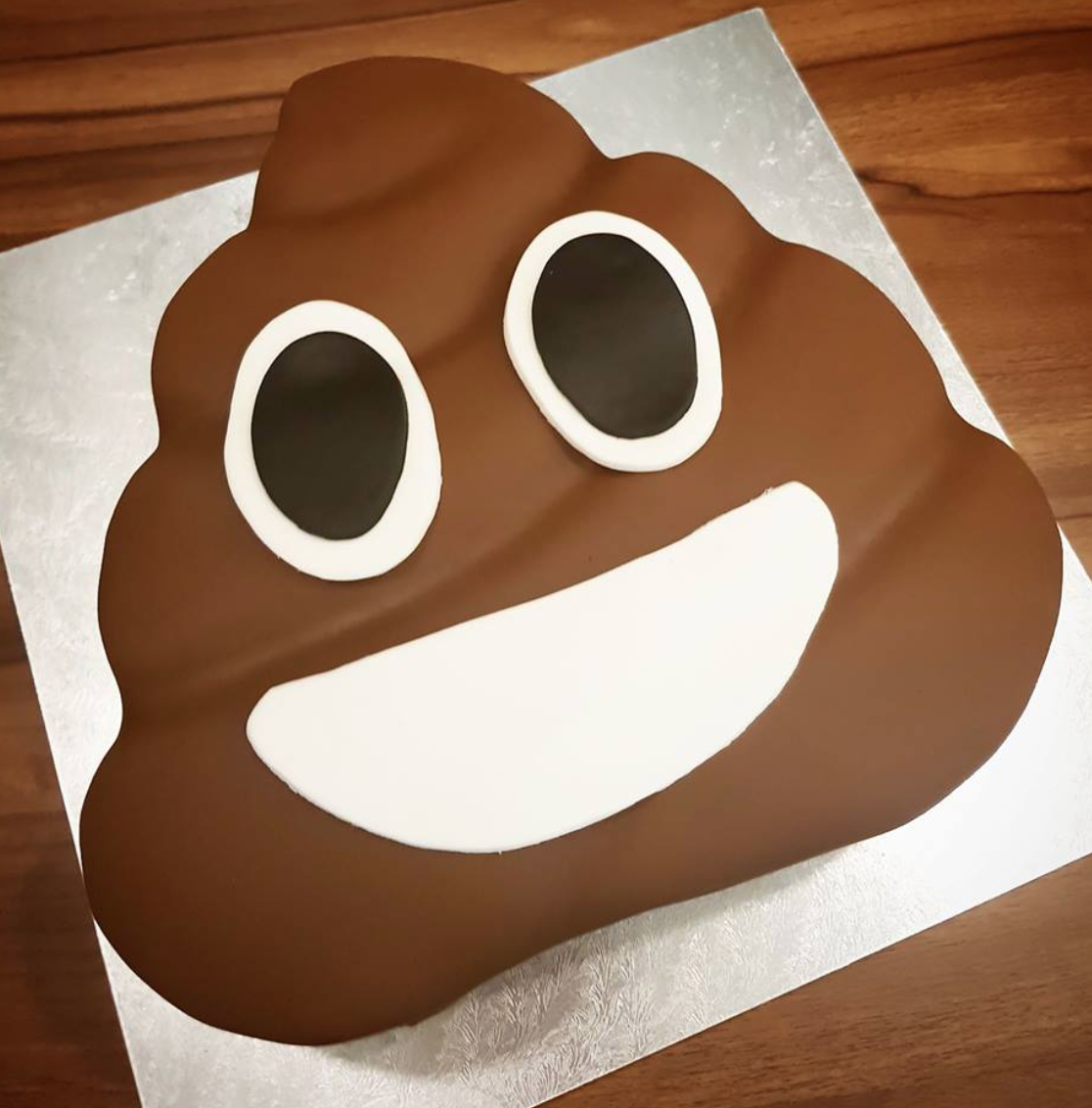 funny poop emoji shaped cake