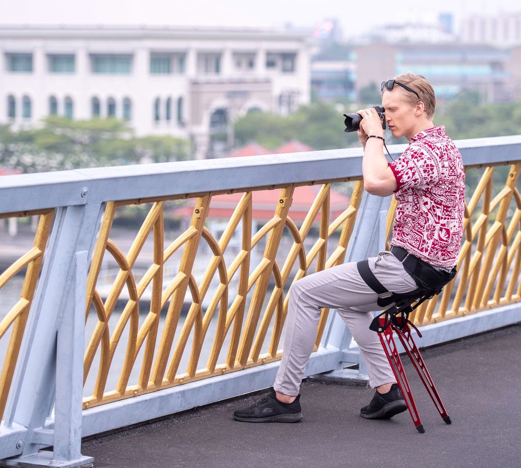 man with a wearable chair